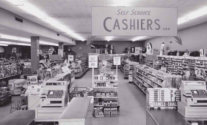 50s-bw-photo-store-self-serve-cashiers-sign