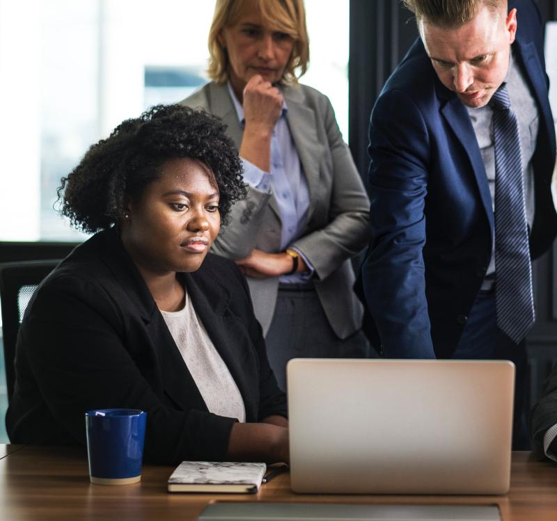 small-group-people-looking-at-a-laptop