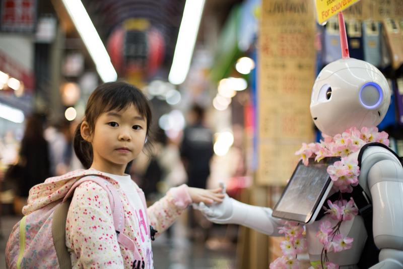 little-girl-holding-hands-with-robot